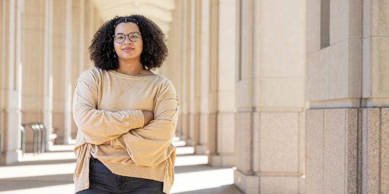 Female student posing for a photo in the Indianapolis government center.