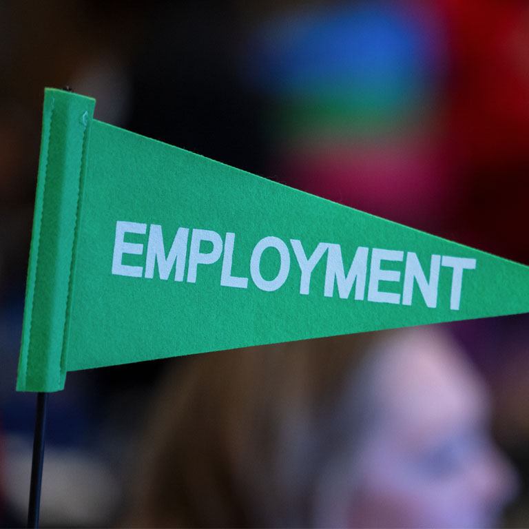Photo of a flag that says employment